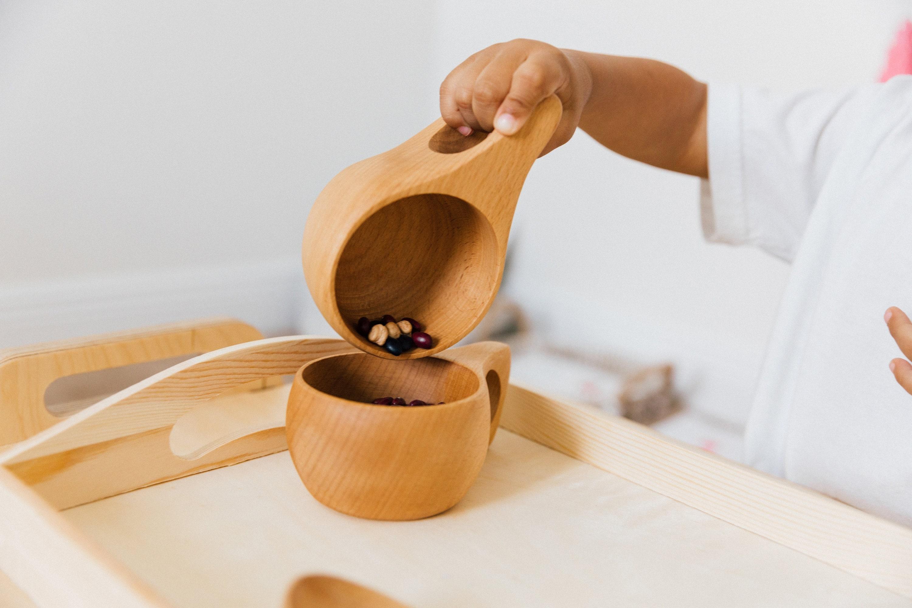 Montessori pouring activity for control of movement