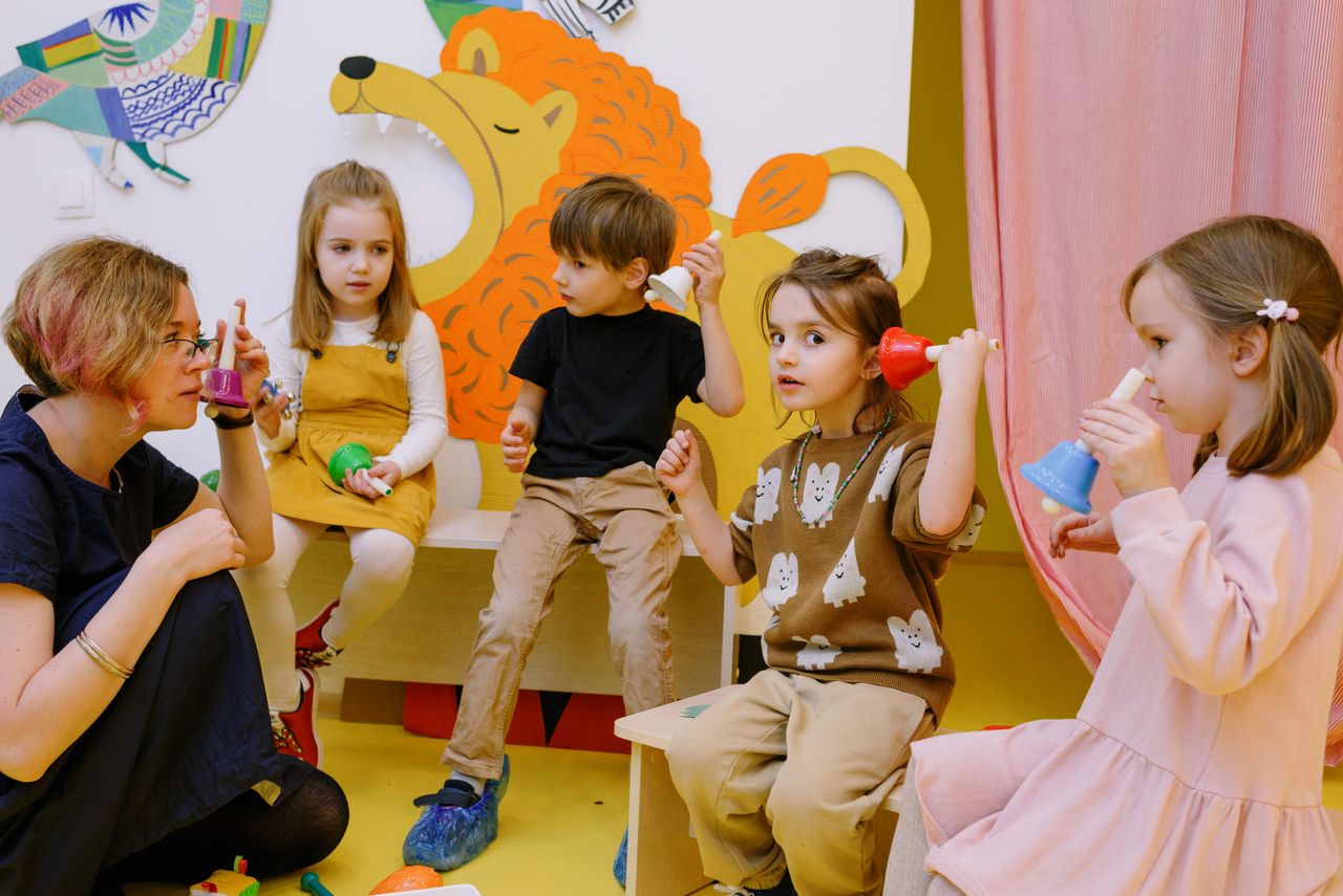 Children participating in music and cultural learning experiences