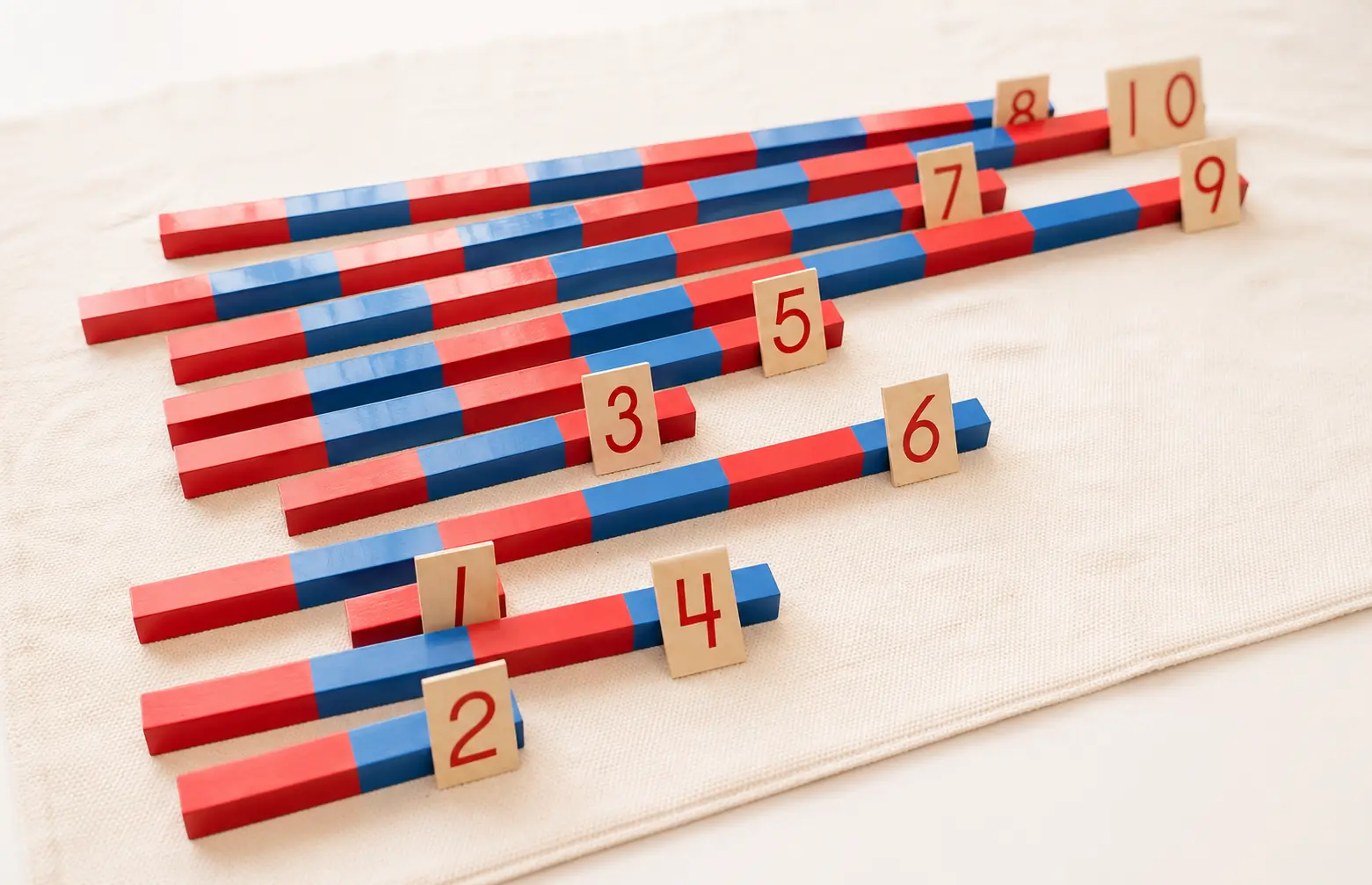 Montessori number rods and numeral cards introducing quantity, sequence, and number relationships